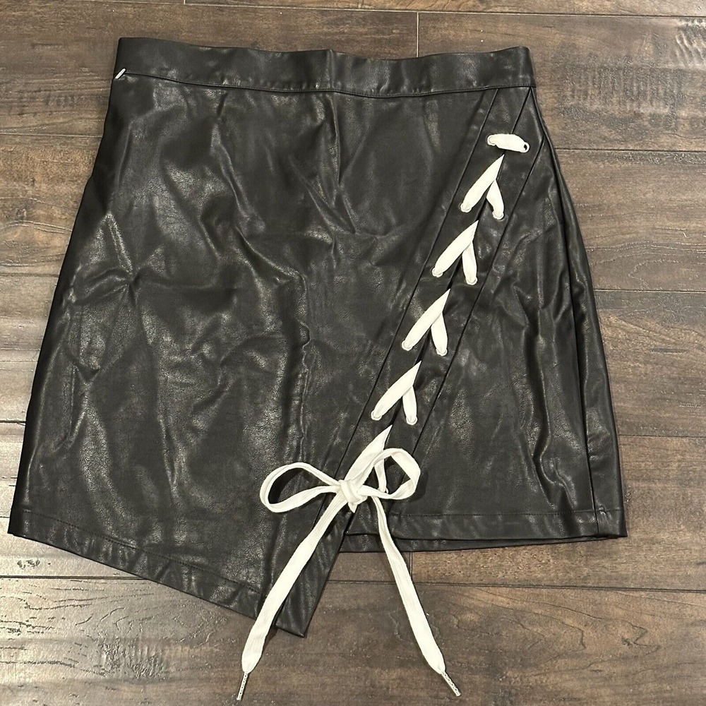 Finesse Black Faux Leather Mini Skirt with White Lace-Up Detail
